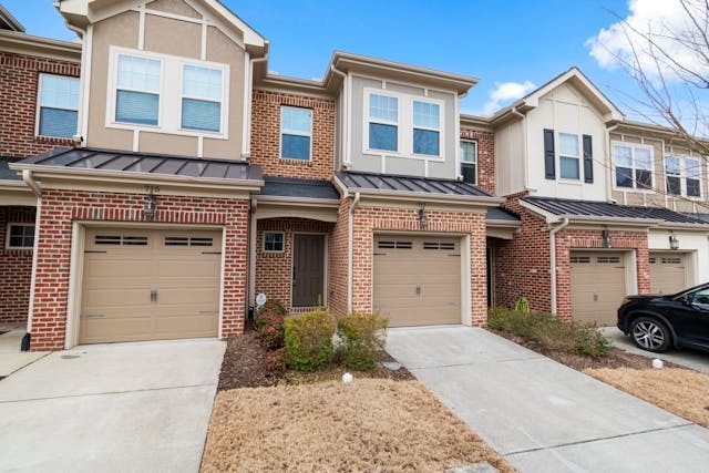 exterior of houses with shrubs in front