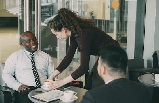 Two people drinking coffee
