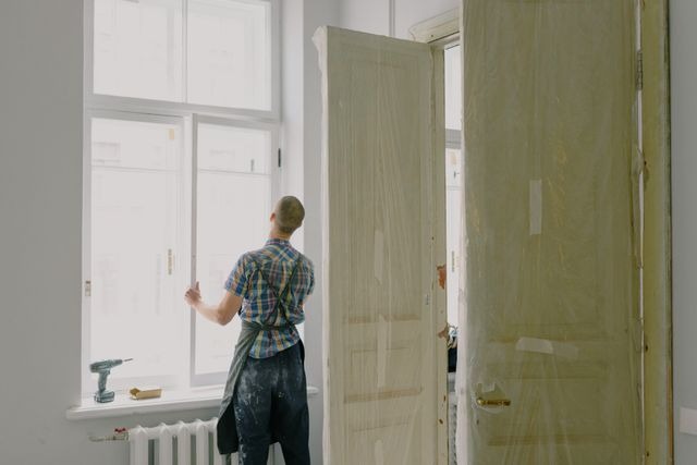 person installing a window