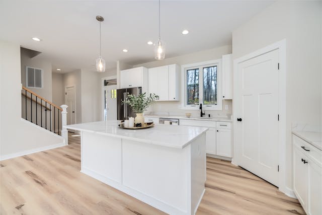 Kitchen with white island in the middle